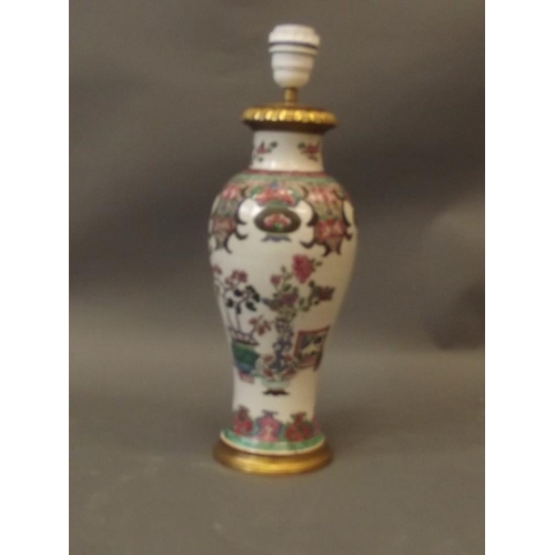 285 - A C19th Chinese famille rose porcelain vase with enamel decoration, drilled and converted to a lamp,... 