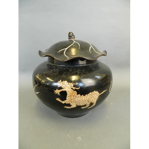 286 - A Chinese Cizhou kiln bulbous jar and cover with chased twin kylin decoration and frilled rim, 11½