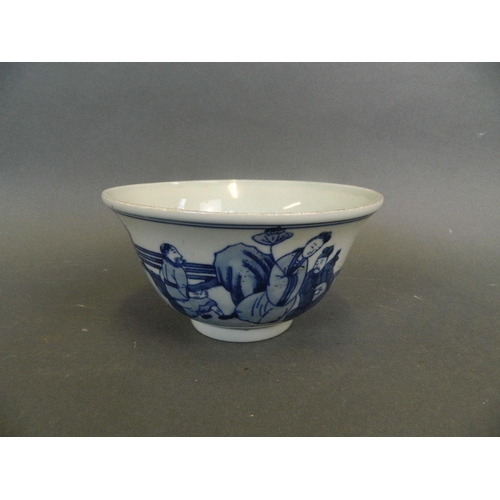 287 - A Chinese blue and white porcelain rice bowl decorated with the Eight Immortals in a garden taking t... 