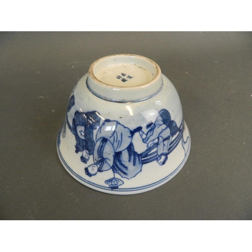 287 - A Chinese blue and white porcelain rice bowl decorated with the Eight Immortals in a garden taking t... 