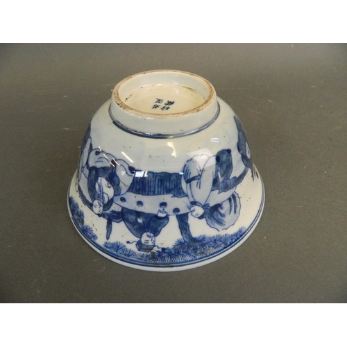 287 - A Chinese blue and white porcelain rice bowl decorated with the Eight Immortals in a garden taking t... 