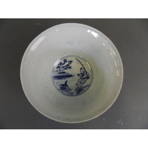 287 - A Chinese blue and white porcelain rice bowl decorated with the Eight Immortals in a garden taking t... 