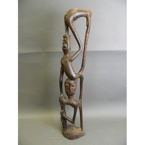 288 - An African hardwood abstract carving of a figure, 28