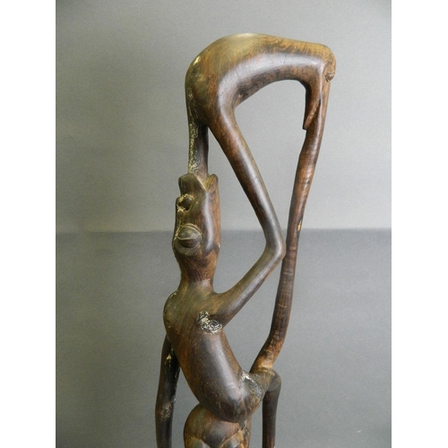 288 - An African hardwood abstract carving of a figure, 28