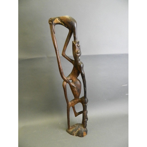 288 - An African hardwood abstract carving of a figure, 28