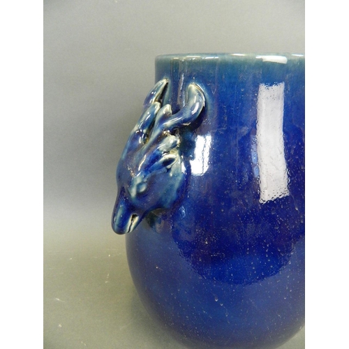 290 - A Chinese deep blue glazed porcelain vase with twin stag mask handles, 10½