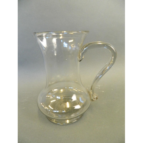 47 - An early C19th blown glass milk jug of baluster form, 7