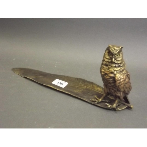 50S - A patinated brass inkwell In the form of an owl with a feather shaped pen tray, 13½