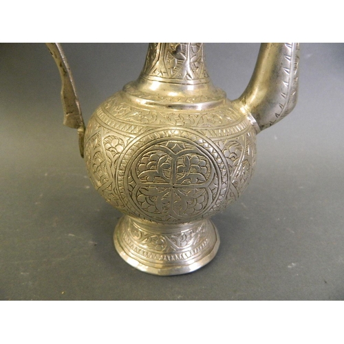 50W - An Indian silvered metal teapot with chased floral decoration, 11½