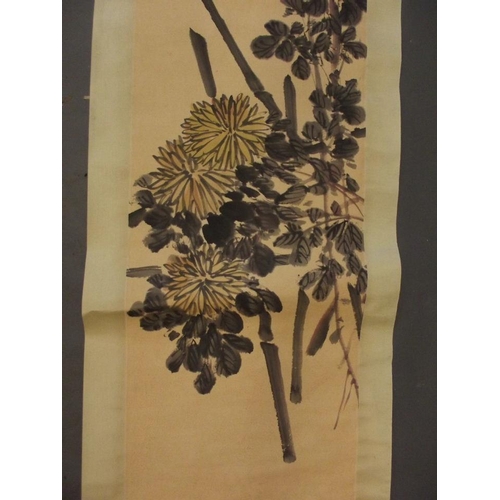 64 - A Chinese watercolour scroll depicting butterflies amongst dahlias, 18