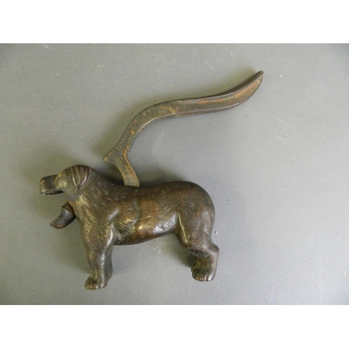 68 - A C19th Eastern bronze nutcracker in the form of a dog, 12