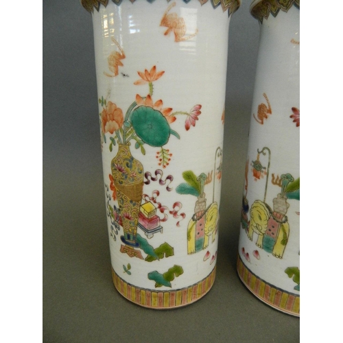 79 - A pair of Chinese porcelain cylinder vases with enamel decoration of objects of virtue, seal mark to... 