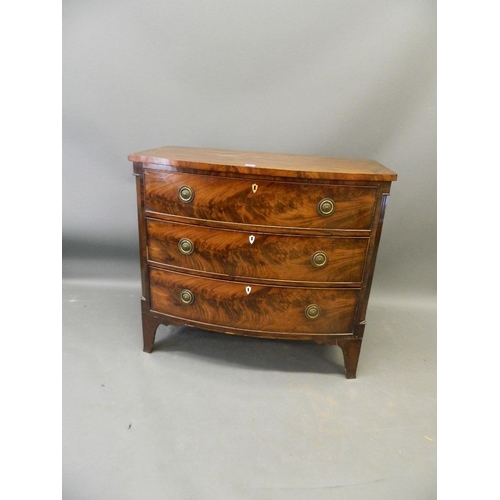 858 - A C19th figured mahogany bow fronted chest of three graduated drawers, raised on swept supports, 43