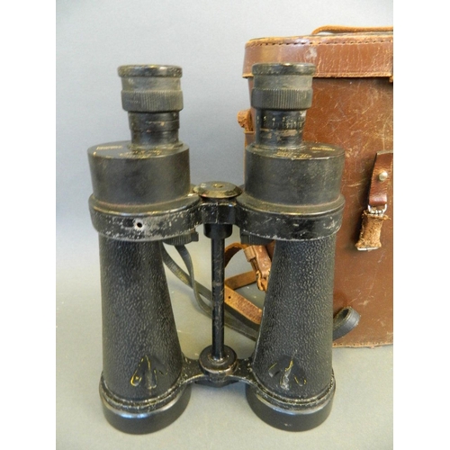 96 - A pair of WWII military binoculars by Barr & Stroud, in a leather case, 9½