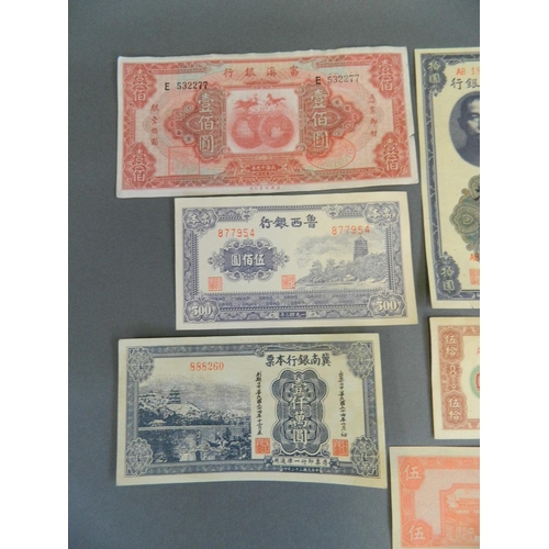 10 - A collection of nine facsimile Chinese bank notes, largest 3½