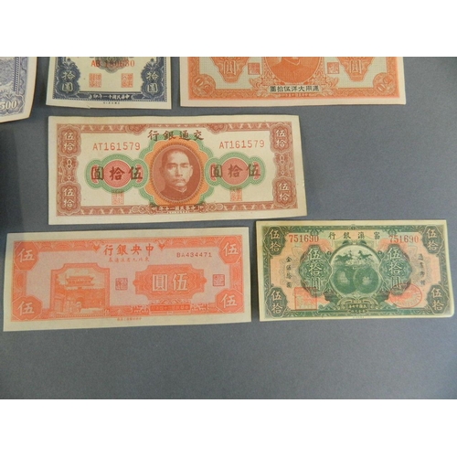 10 - A collection of nine facsimile Chinese bank notes, largest 3½