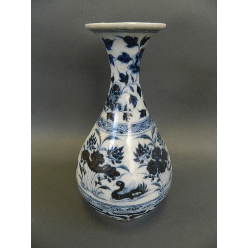 103 - A Chinese Ming style blue and white porcelain pear shaped vase decorated with waterfowl in a lotus p... 