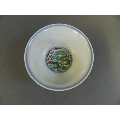 111 - A Chinese Doucai enamel porcelain rice bowl with dragon and flaming pearl decoration, 6 character ma... 