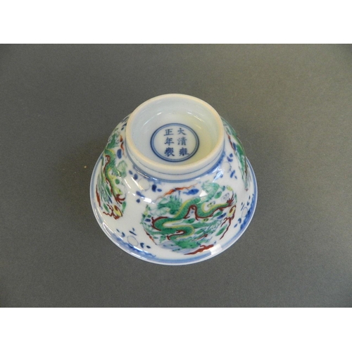 111 - A Chinese Doucai enamel porcelain rice bowl with dragon and flaming pearl decoration, 6 character ma... 