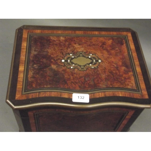 132 - A C19th French amboyna tantalus with ebony and rosewood inlaid decoration and brass mounts, opening ... 