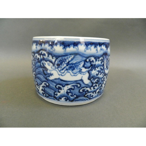 142 - A Chinese blue and white porcelain pot and cover decorated with mythical beasts, 6 character mark to... 