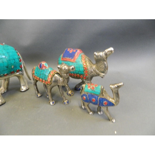 150T - A collection of Middle Eastern mixed metal figure groups, comprising a caravan of camels, and elepha... 