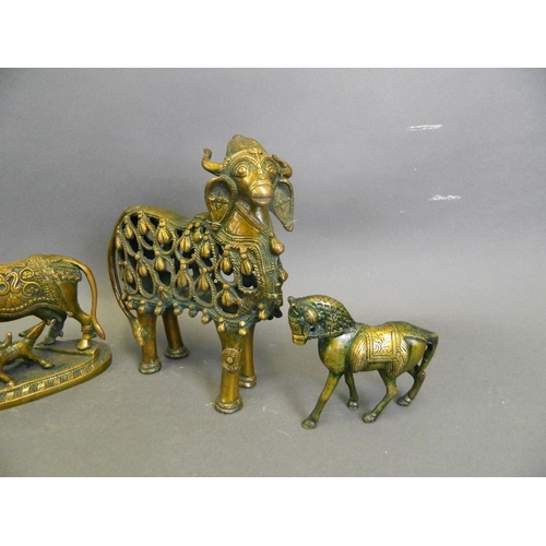 150V - A collection of Eastern lacquered bronze animals to include two Indian ceremonial cows, and a pair o... 