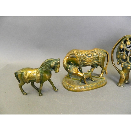 150V - A collection of Eastern lacquered bronze animals to include two Indian ceremonial cows, and a pair o... 