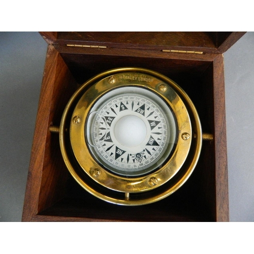 176 - A brass gimbal mounted marine compass by Stanley, in a hardwood case, 6½