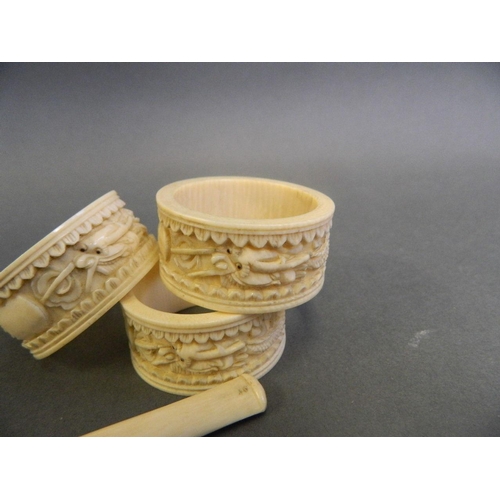 179 - A Cantonese ivory cheroot holder with carved dragon decoration, together with three Cantonese ivory ... 