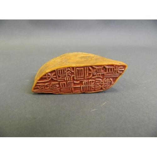 190 - An early Chinese soapstone seal with carved decoration of sages in mountain landscapes, 3