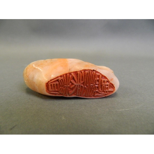 194 - A Chinese carved soapstone seal in the form of peaches, 6 character mark verso, 3