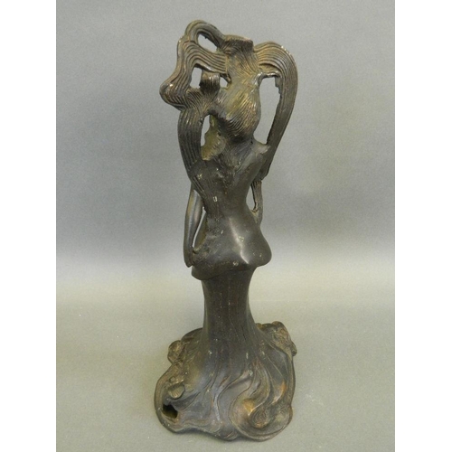 195 - An Art Nouveau style bronze figure of a stylised lady, 13