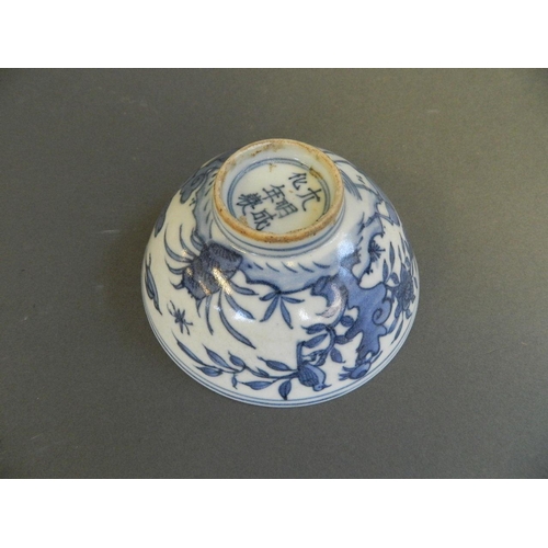 207 - A Chinese blue and white porcelain rice bowl with painted decoration of birds and deer in a rural la... 