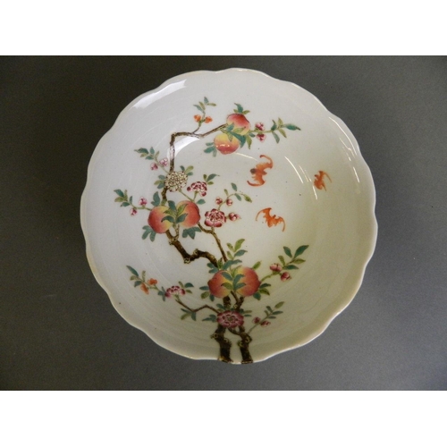 218 - A Chinese polychrome enamel porcelain bowl with frilled rim decorated with bats amongst a peach tree... 