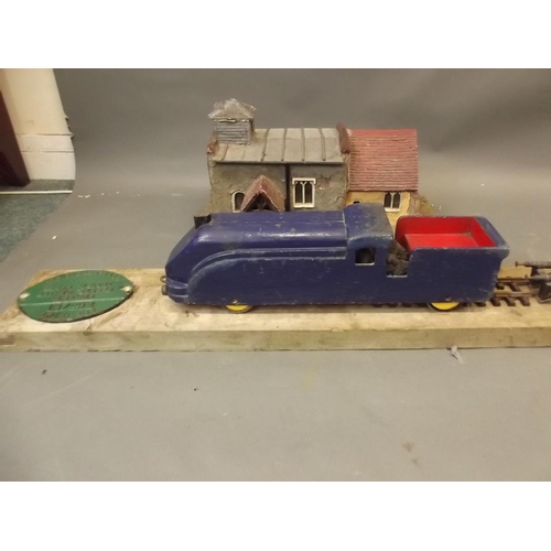 220 - A wooden model of a train and station, bears cast iron British Rail weight limit plaque, c1968, 46