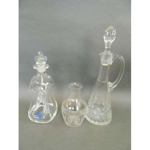 24 - A conical glass claret jug, together with a dimple glass decanter and a cut glass caraf, 14