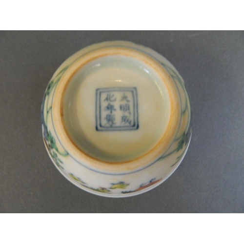 25 - A Chinese Doucai porcelain tea bowl with enamelled chicken decoration, 6 character mark to base, 3