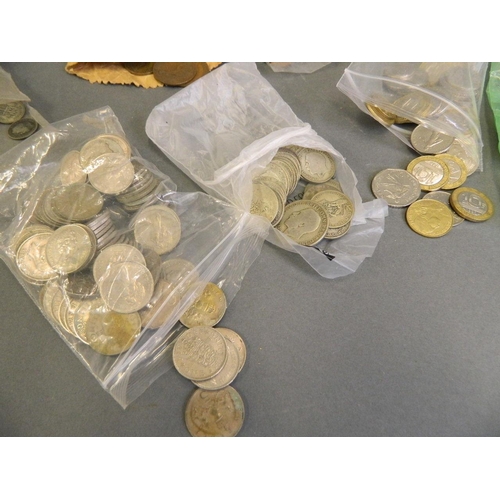 250N - A quantity of British and world coinage including shillings, six pences, Franks, US Dollars, HK Doll... 