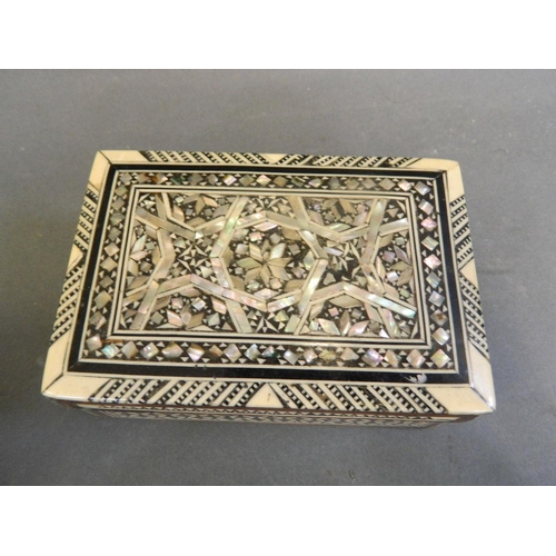 250S - A Moorish Mother of Pearl and bone inlaid trinket box, together with three small trinket boxes, a Mo... 