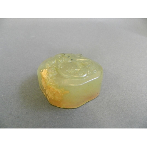 255 - A Chinese mottled jade seal with carved dragon decoration, 2