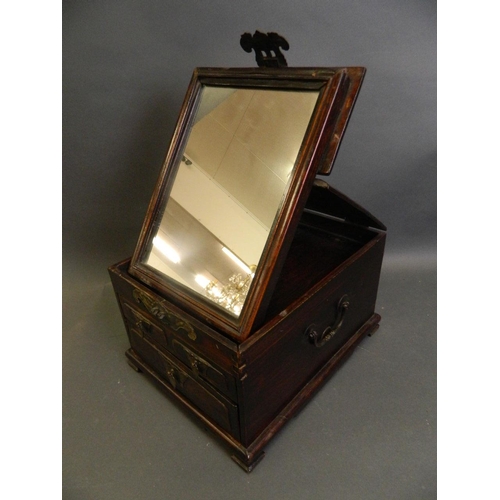 281 - A Chinese hardwood vanity box with three drawers and folding mirror