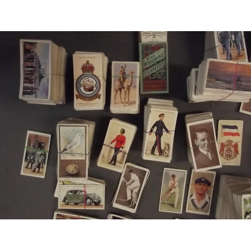 285 - A large quantity of cigarette cards including Wills, Players, Carrera etc, various subjects, part se... 