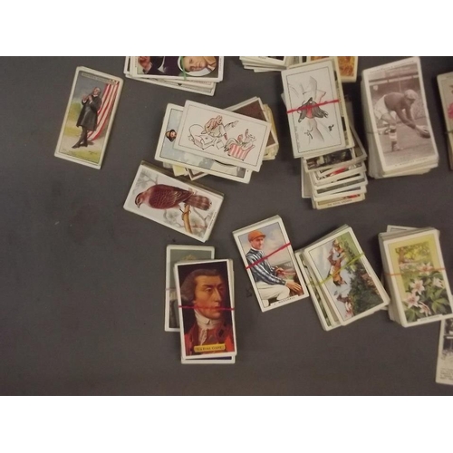 285 - A large quantity of cigarette cards including Wills, Players, Carrera etc, various subjects, part se... 