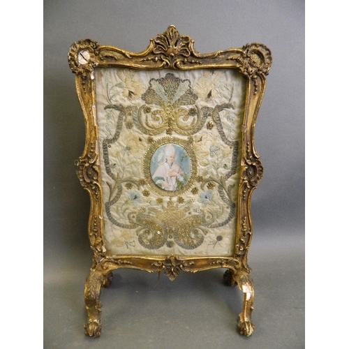 293 - An Italian gilt plaster table screen with a gold and silver thread embroidered silk panel with centr... 