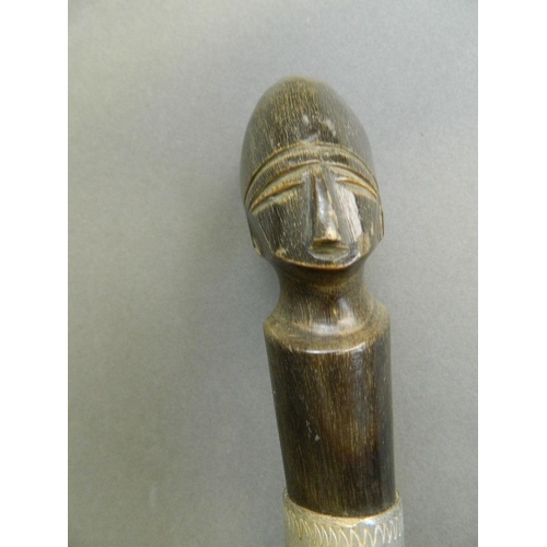 312 - An African carved horn walking stick, the handled carved as a head, 41