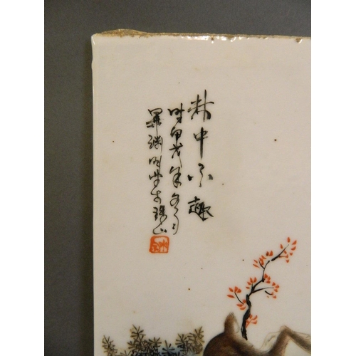 323 - A Chinese famille verte porcelain plaque with enamelled decoration of rabbits, 10