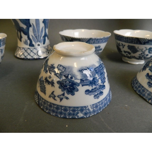 350C - A pair of English blue and white porcelain jars decorated with Asiatic pheasants, together with six ... 