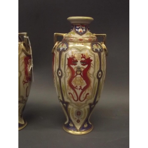 350D - A pair of Noritake ring handled vases with lotus and dragon decoration and gilt highlights, 11