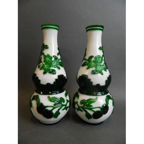 350F - A pair of Peking glass double gourd shaped vases with overlaid decoration of fruiting peach tree bra... 